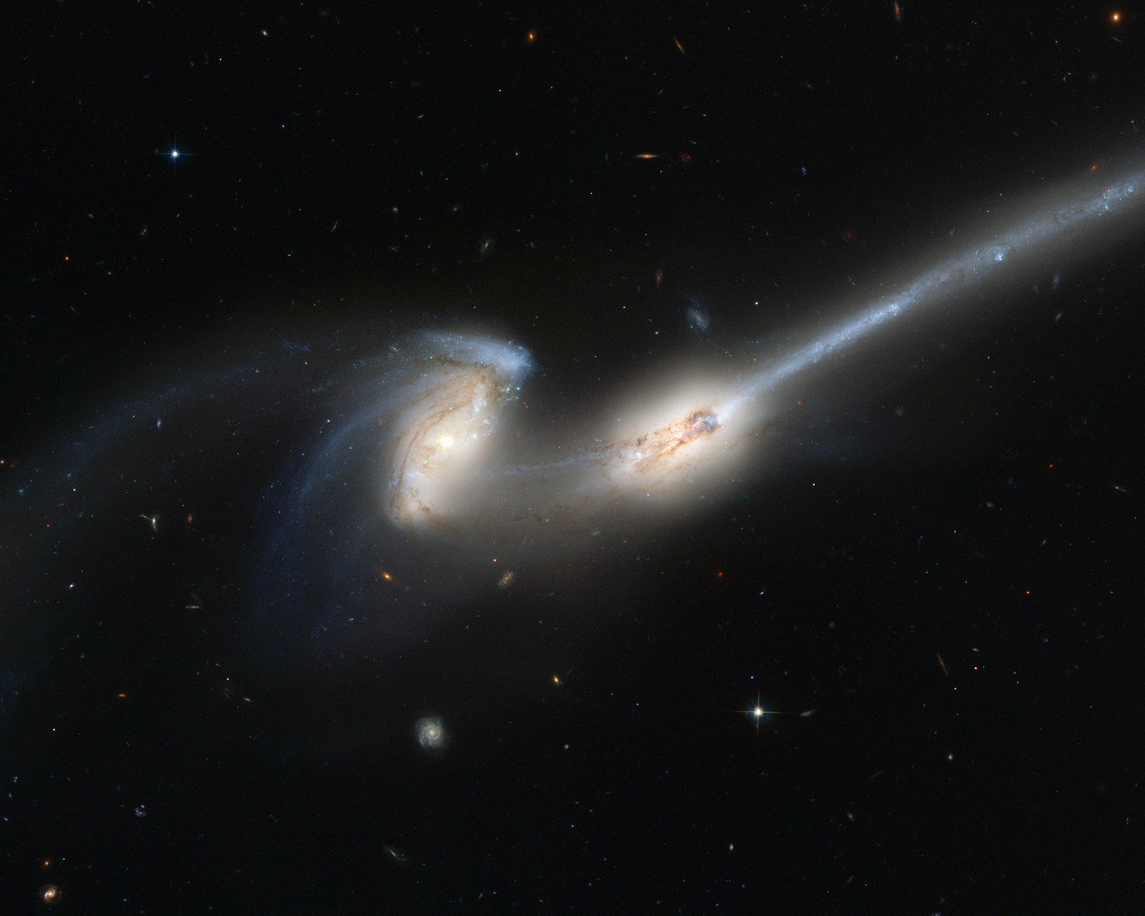 Hubble's newest camera takes a deep look at two merging galaxies