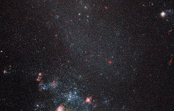 Faint galaxy with popping pink features