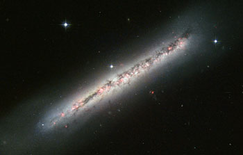 Glowing gas and dark dust in a side-on spiral